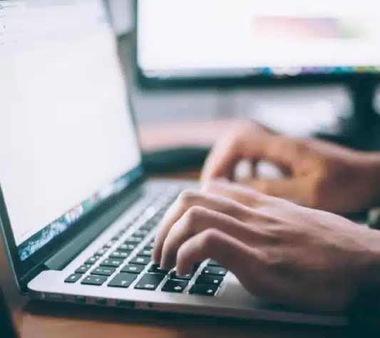 Part time safety trainer writing reports on safety classes he just did.