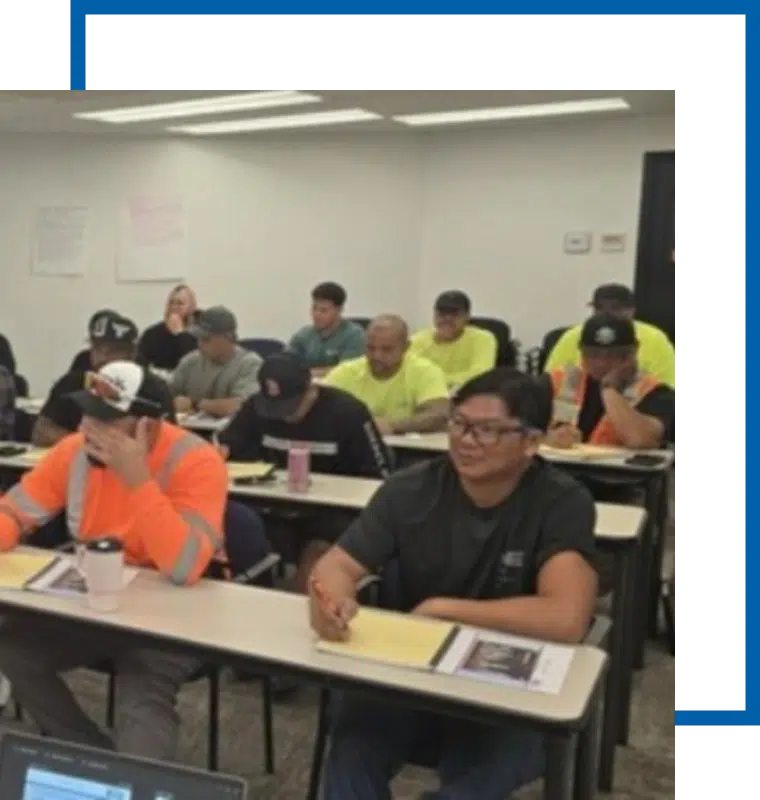 rts-training-class-oahu Hawaii Site Safety and Health Officer instructs construction safety course during OSHA training in Honolulu. Classroom of construction workers.