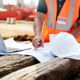 An RTSC consultant in a hard hat inspecting a Honolulu construction site, representing expert construction safety consulting in Hawaii.